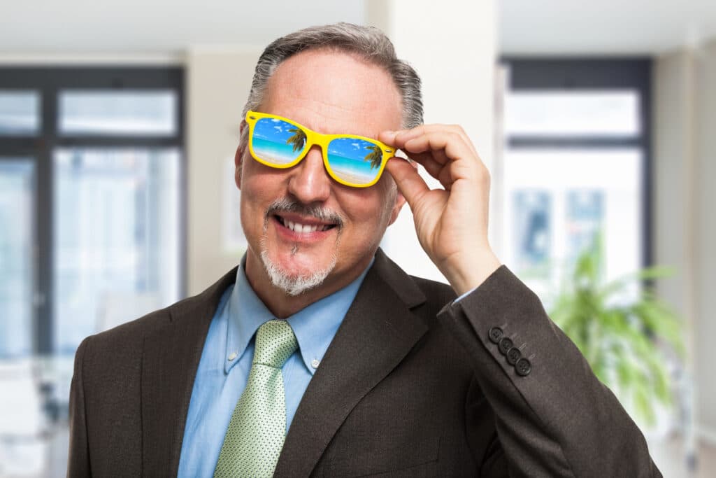 reducing owner dependence - older businessman thinking of vacation